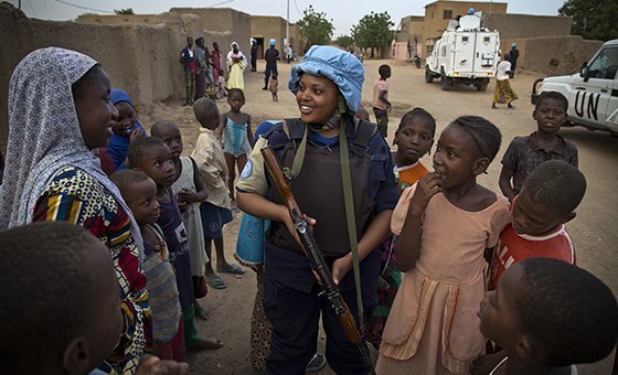 MINUSMA Officer from Rwanda speaks to the population, while patroling the streets of Gao, North of Mali.